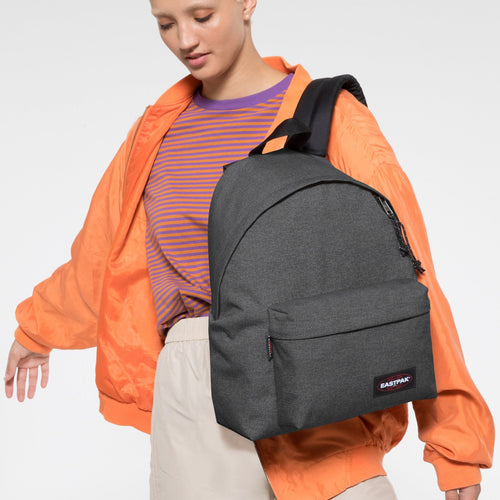 Padded Pak'r Black Denim Backpack Front View With Model Wearing Bag Over Shoulder