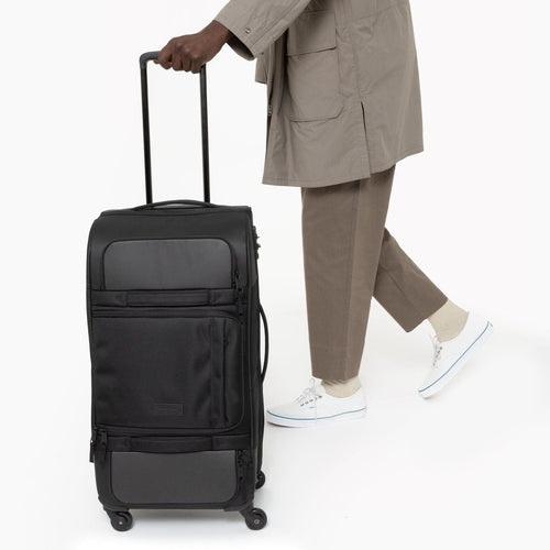 person using Ridell M Cnnct Coat Roller Luggage