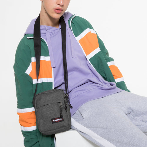 The One Black Denim Crossbody Bag Around Neck Of Model