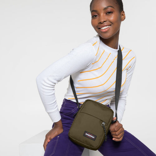 The One Army Olive Crossbody Bag Over Shoulder Of Model