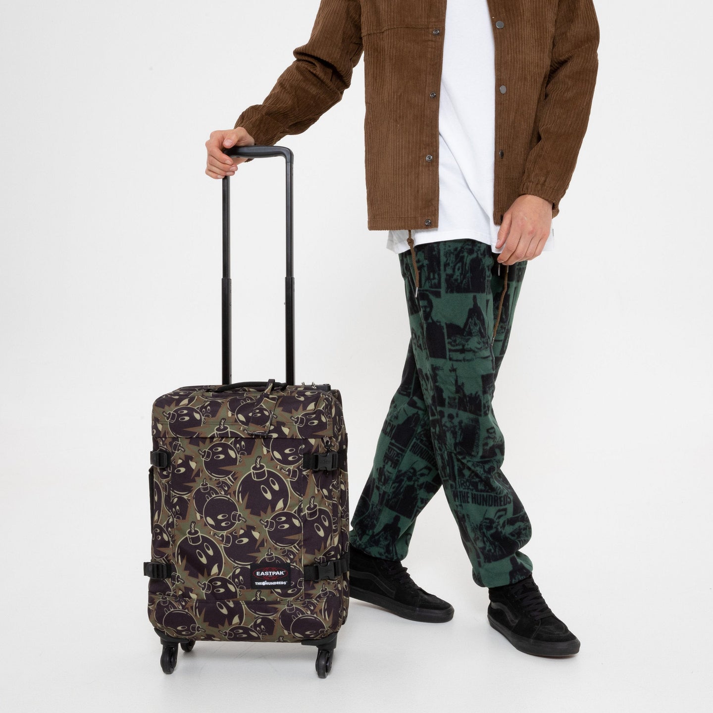 person using TRANS4 S Hundreds Camo Wheeled Luggage