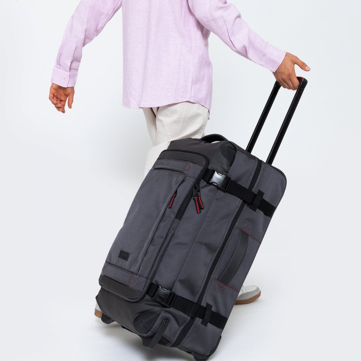 Tranverz Cnnct M Accent Grey Roller Luggage Side View With Model Walking