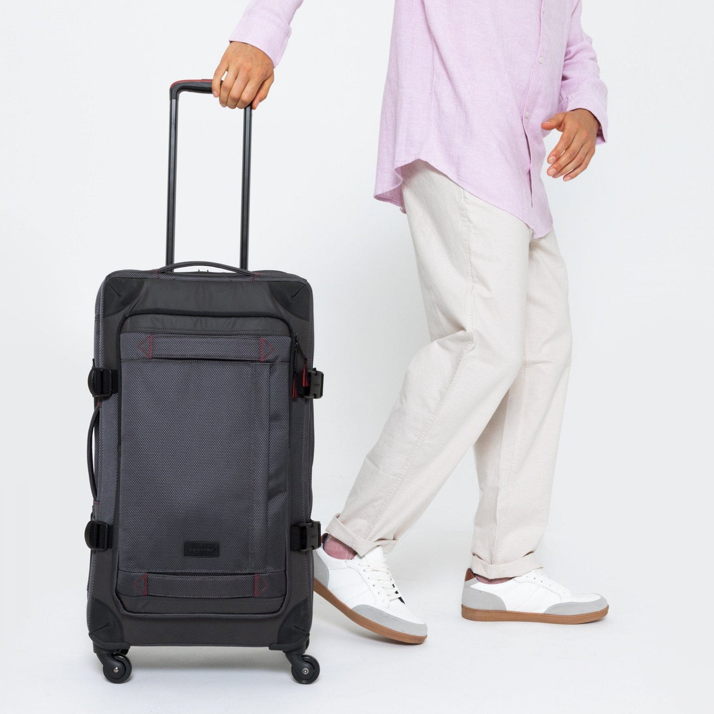 Trans4 Cnnct M Accent Grey Roller Luggage Front View With Model Walking