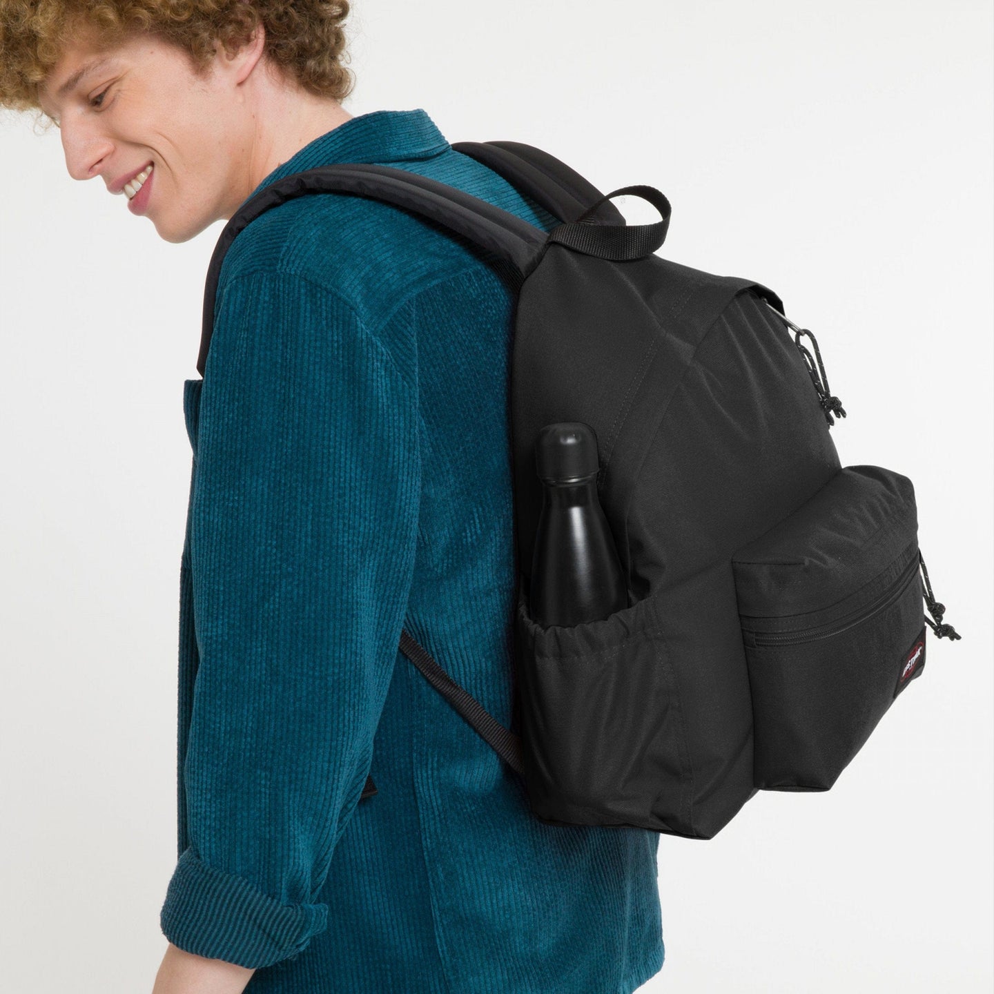 man wearing Padded Zippl'r + Black Backpack