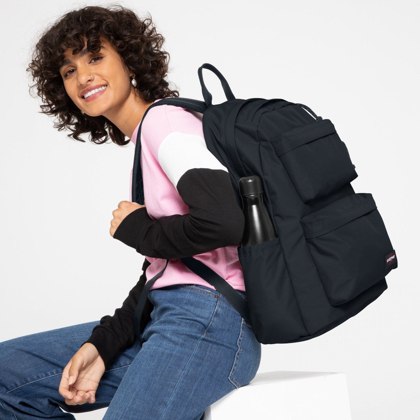 woman wearing Padded Double Cloud Navy Backpack