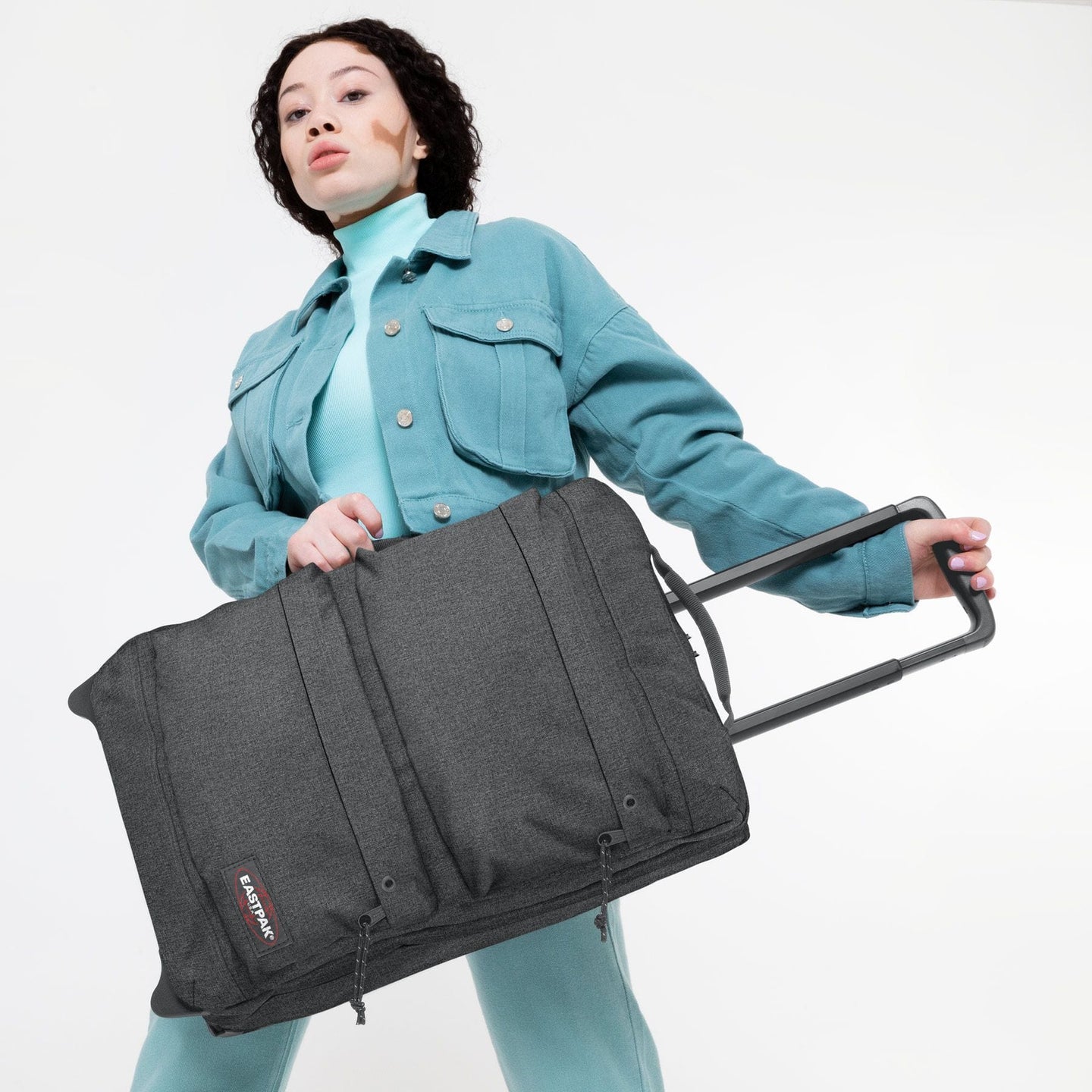 woman with Double Tranverz S Black Denim suitcase